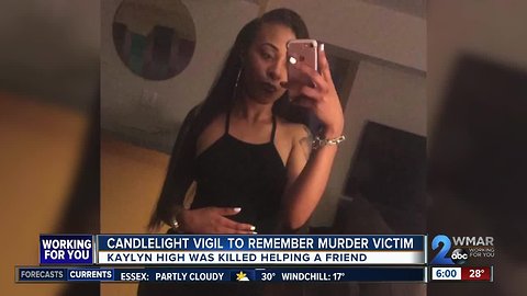 Community holds vigil for woman who helped friend escape domestic violence
