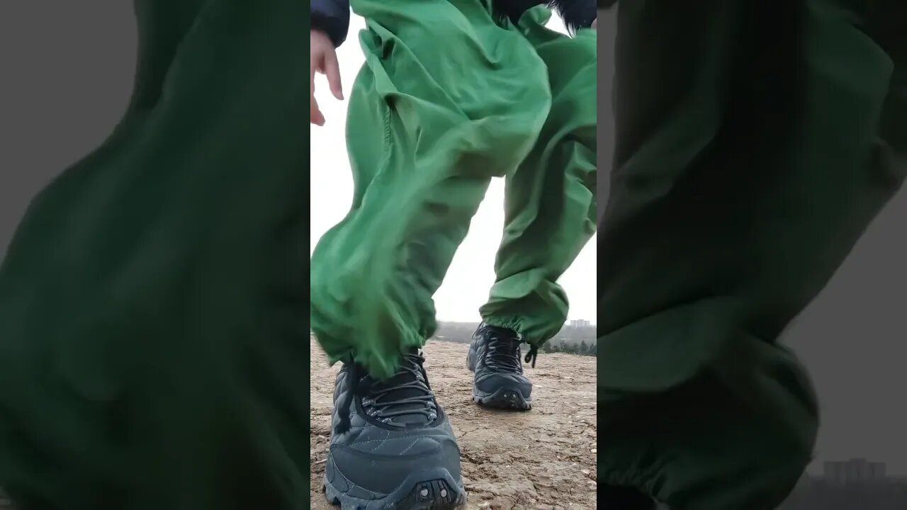 Green parachute pants flapping