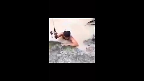 funny video a big fish catch his .....?