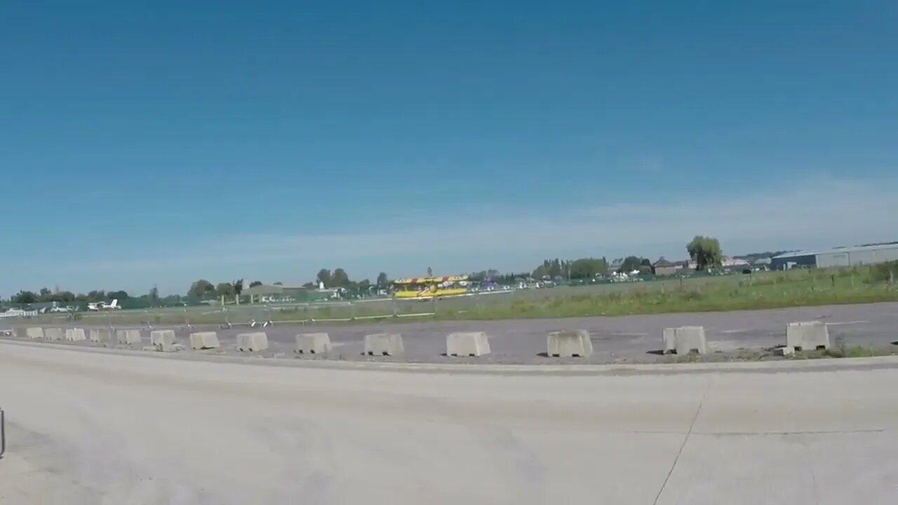 Lunatic Stands On The Wings Of A Biplane.