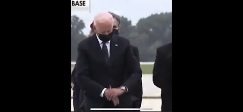 Biden checks his watch during Dignified transfer of 13 Fallen Soldier