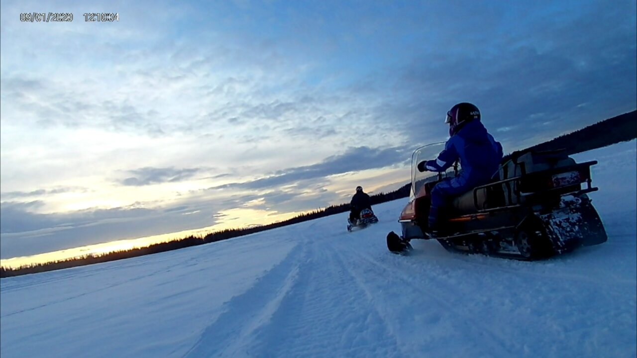 Snowmachining (snowmobiling) on the Tanana River, Alaska