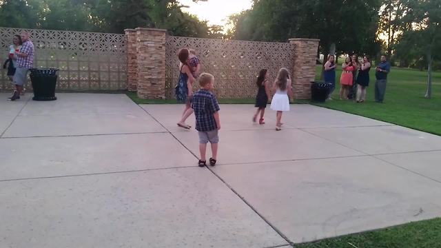 Little Boy Stops Dancing To Watch Two Girls Walk By