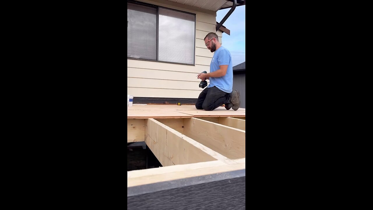 Crew worked hard getting plywood and vinyl installed while keeping everything dry
