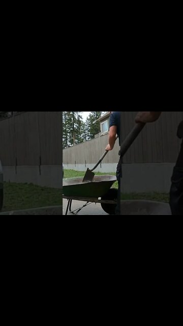 Mixing concrete by hand for post holes. #shorts #handyman