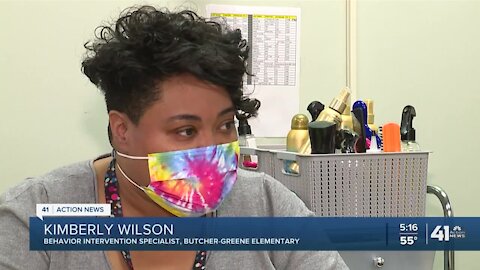 Educator works to boost students' self esteem through hair cuts