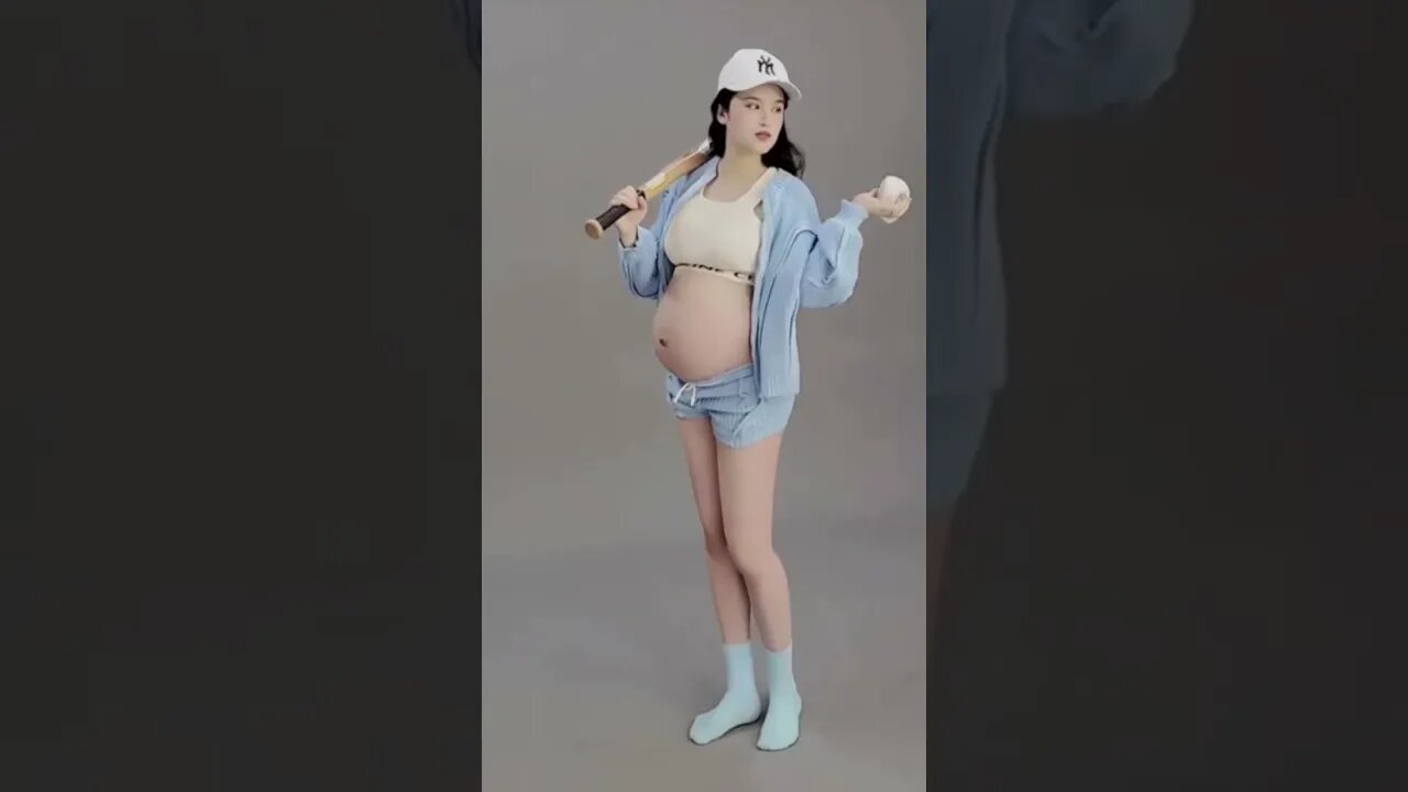 Chinese Beauty Shows Off Her Baby Bump