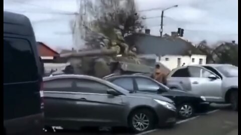 Tanks rolling through the streets of Ukraine today, crushing cars in the way