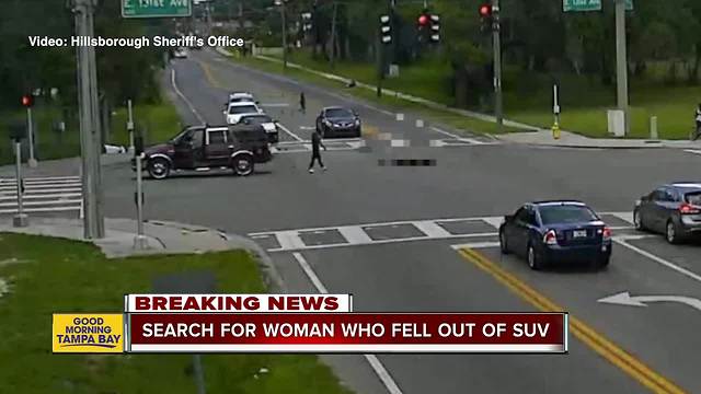 VIDEO: Woman appears to fall out of moving Ford Expedition in Tampa intersection near USF