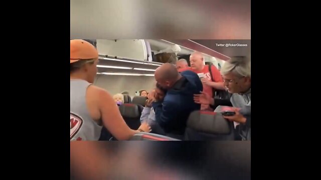 AA passenger gets put in a headlock and escorted off plane after yelling an anti-Semitic slur