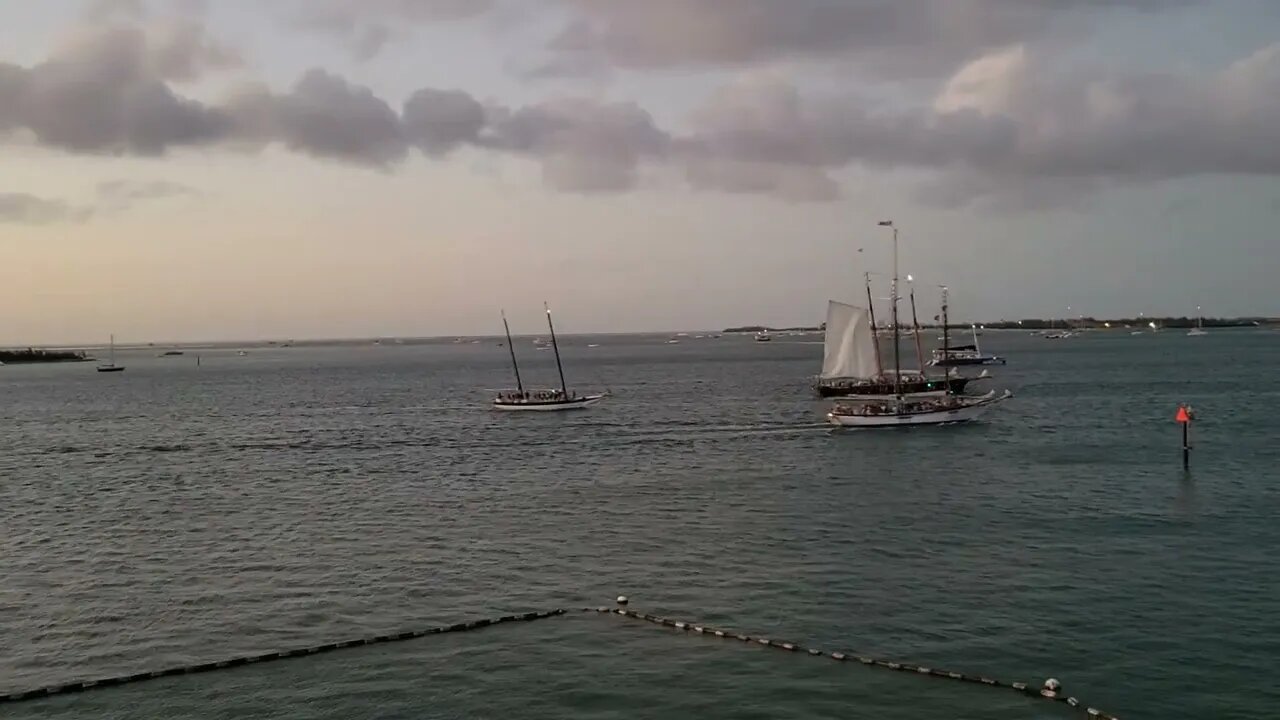 Sun Setting and Boats Returning