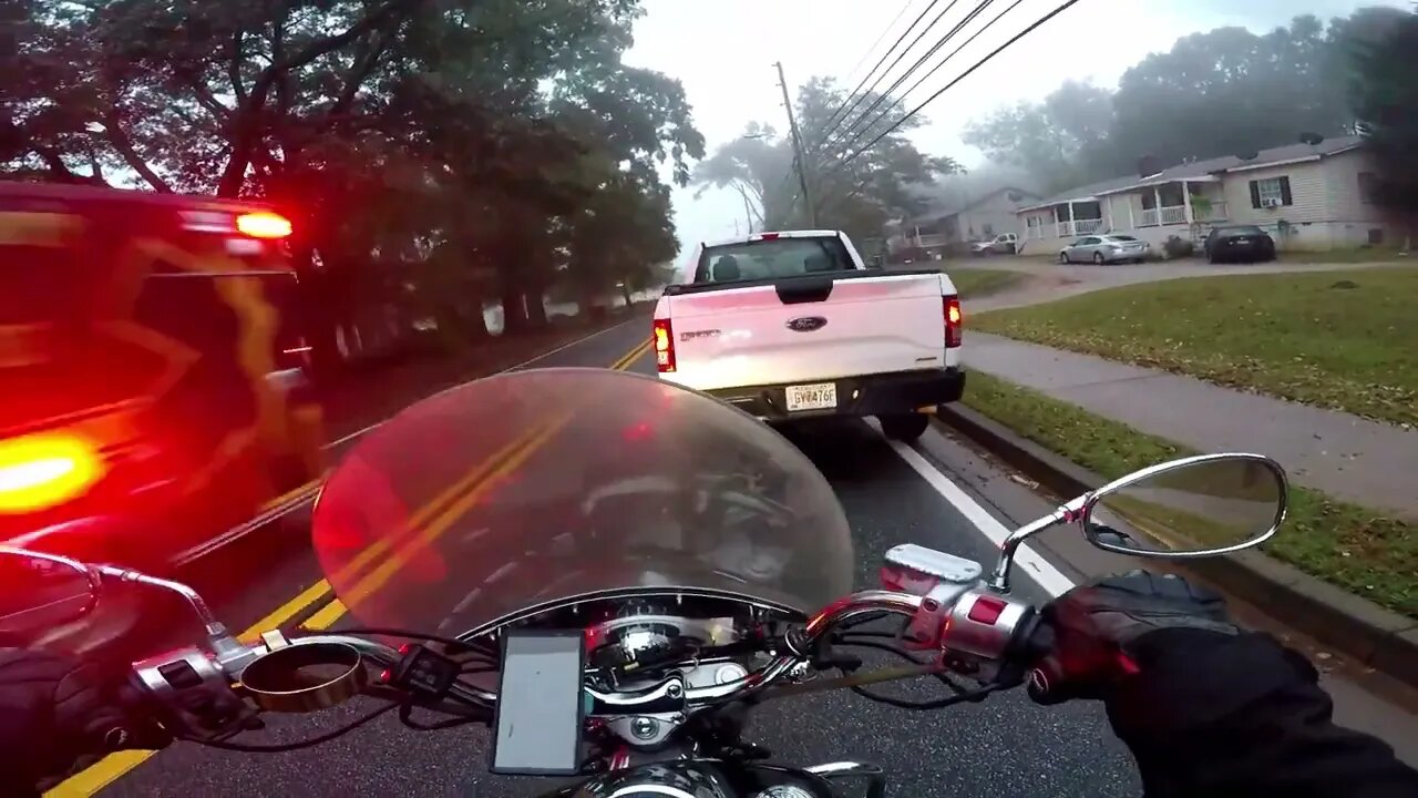 Biker Slides on a Wet Road