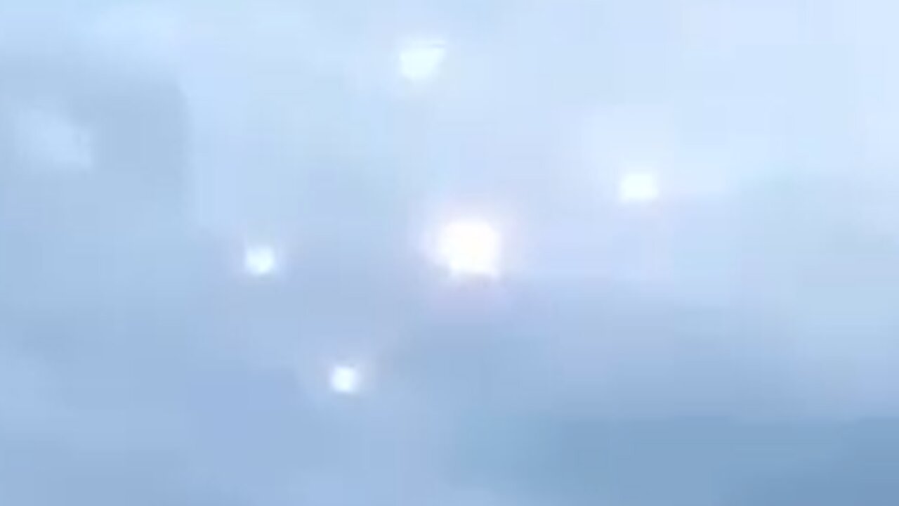 A small light body UFO leaves a light body UFO