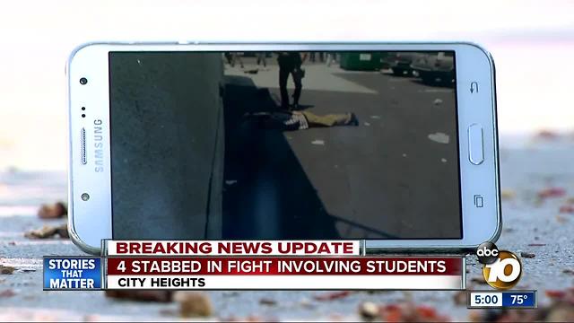 4 kids stabbed in brawl outside high school