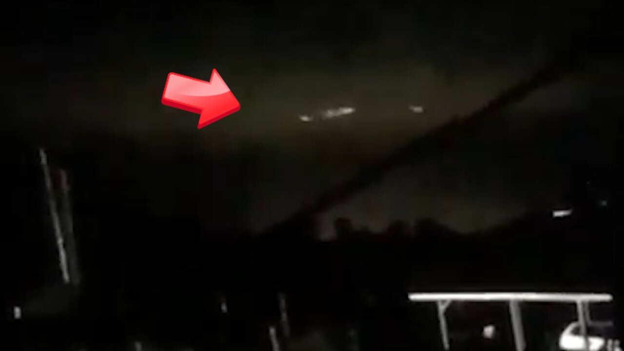 Triangular-shaped UFO spinning in the sky above at night while floating [Space]