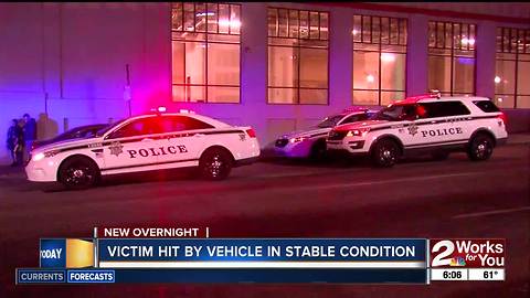 Person recovering after being hit by a vehicle in downtown