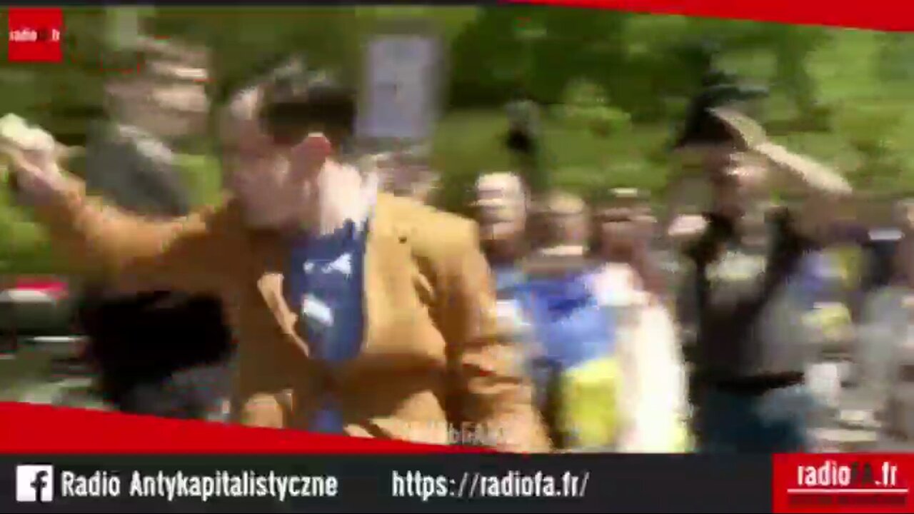 Polish political scientist Tomasz Jankowski braves violent Ukrainian crowd to lay flowers at the monument to the Soviet soldiers who liberated Warsaw
