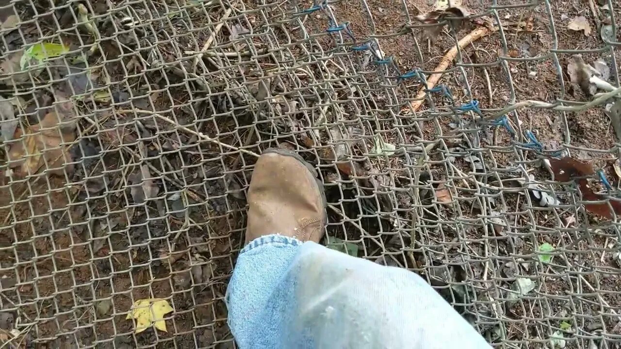 Project Chicken: Fixing the huge gaps under the old chain link fence.