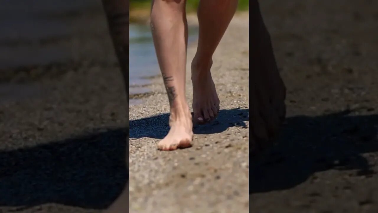 Walking On Warm Beach Sand By Sea