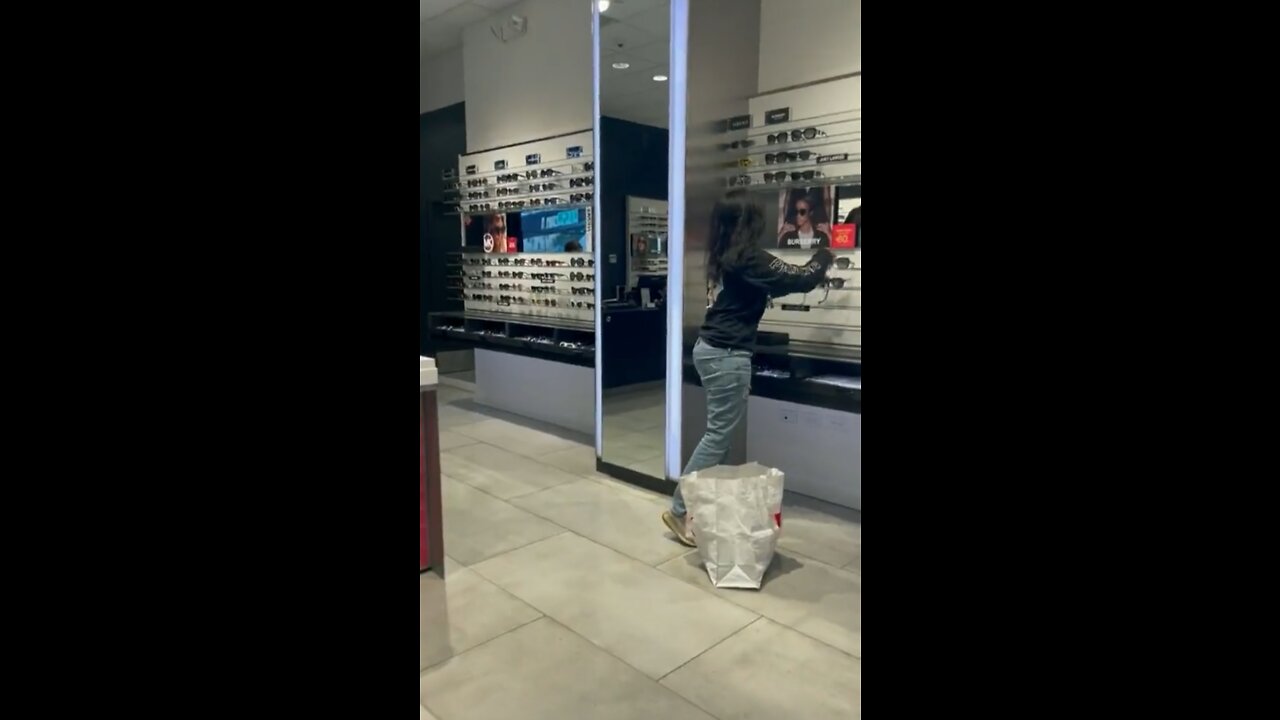 A Woman Casually Steals Sunglasses From A Store
