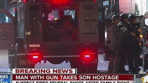Man with a gun takes son hostage