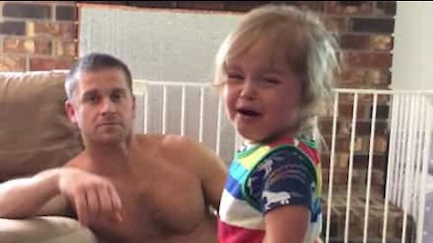 Dad stops daughter crying with foolproof trick!