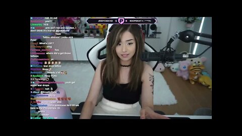 Poki Flexing Her New Tattoo