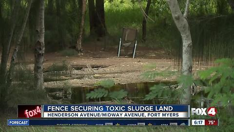 Barrier fence being installed at toxic Dunbar site