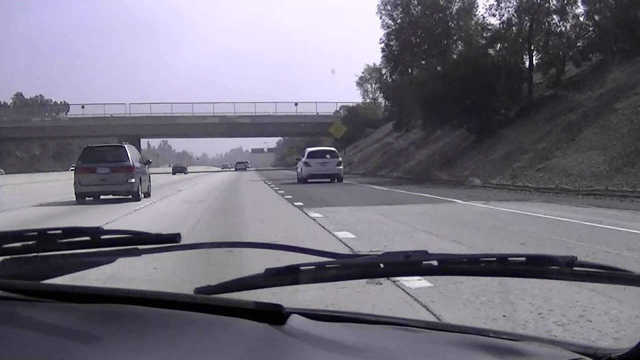 Custom Porsche 911 cruising on Los Angeles Freeway