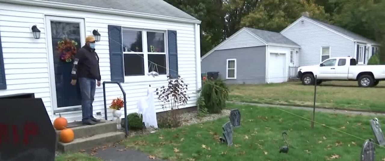 Rhode Island man gives out socially distant candy for Halloween