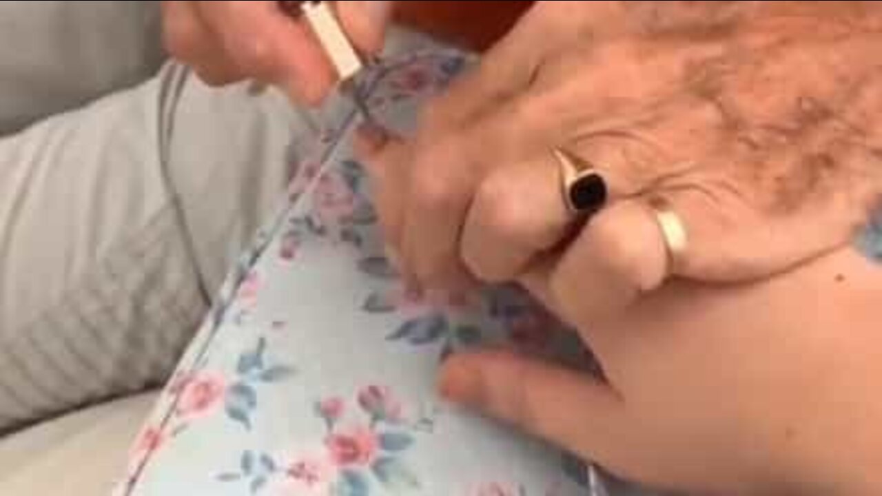 Grandfather gives manicure to hospitalized granddaughter