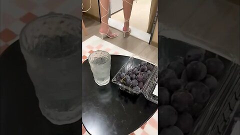 Tall Hot Chinese Girl Offe Some Red Grapes