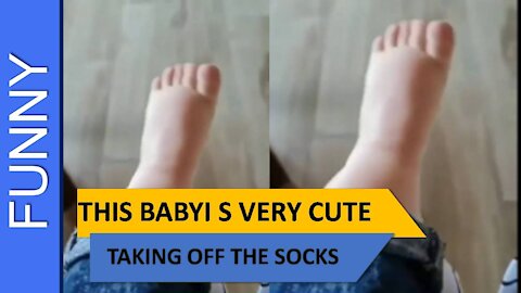 the video of the baby taking off the socks is so cute