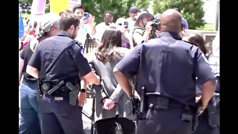 AOC Pretends to be Arrested in Viral Stunt