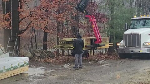 Delivery of barn lumber in the rain