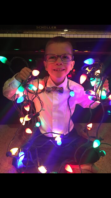 Gifted child plays O Come O Come Emmanuel