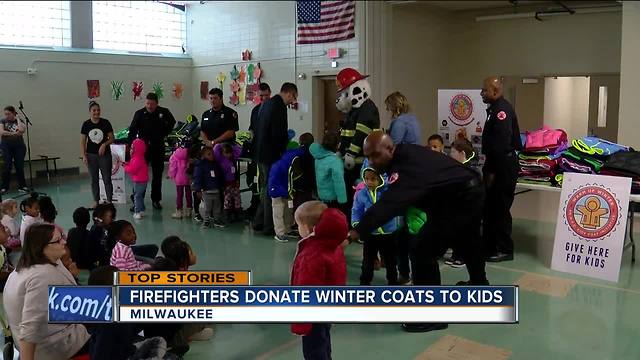 firefighters donate winter coats to kids