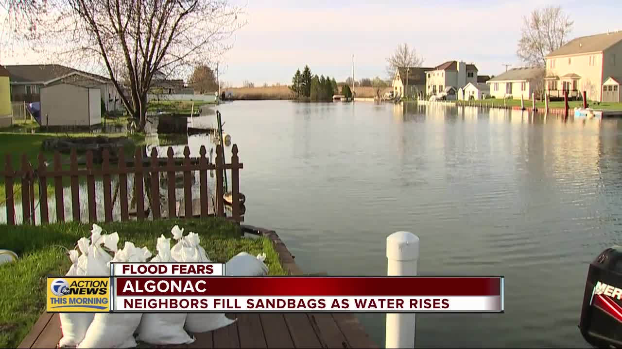 Neighbors fill sandbags as water rises in Algonac