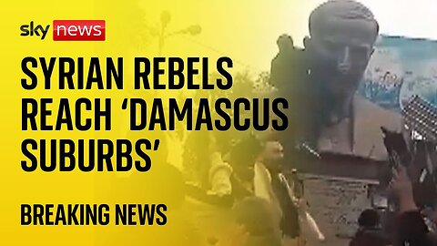 BREAKING: Syrian rebel forces 'reach Damascus suburbs' as protesters topple statue on outskirts