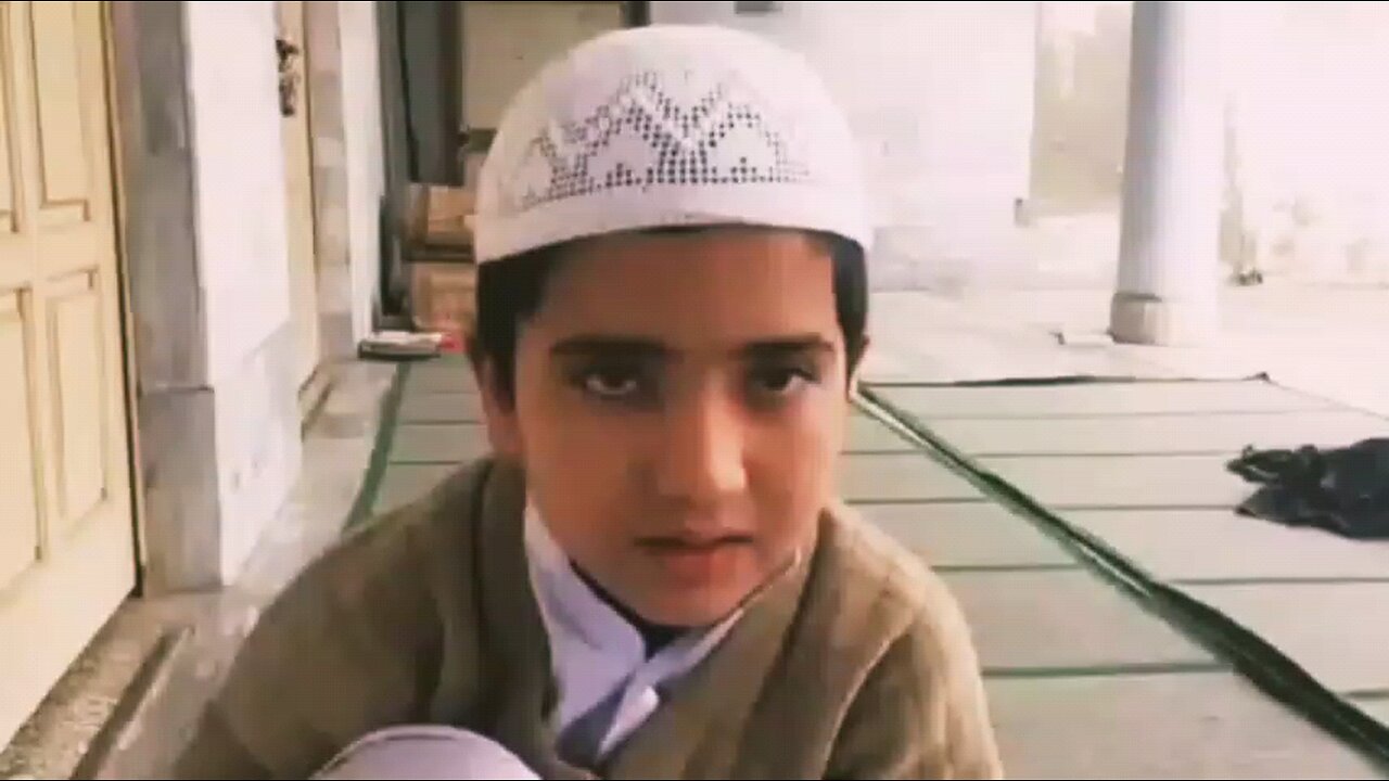 Quran recitation by a small Pakistani boy.