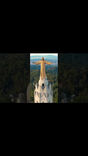 Statue of Christ on top of the Sacred Heart Temple in Barcelona.