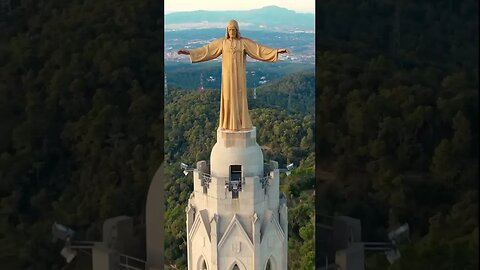 Statue of Christ on top of the Sacred Heart Temple in Barcelona.