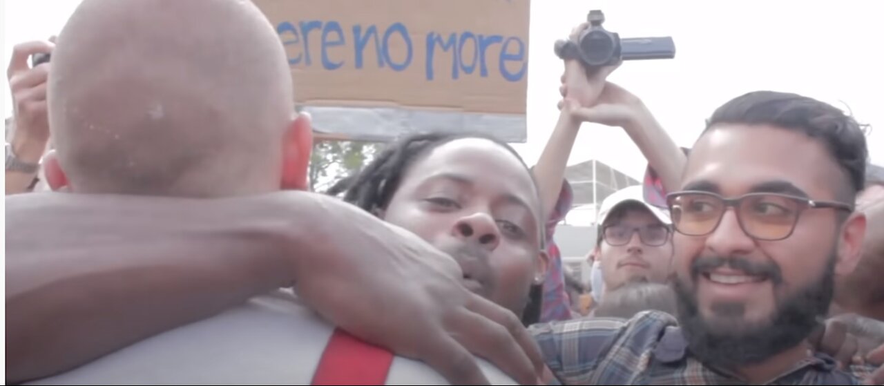 Black Protester Hugs A Nazi And Asks 'Why Do You Hate Me?'