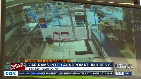 SUV slamming into laundromat caught on camera