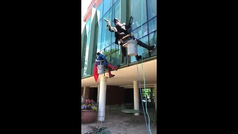 Superheroes wash windows at Akron Children's Hospital