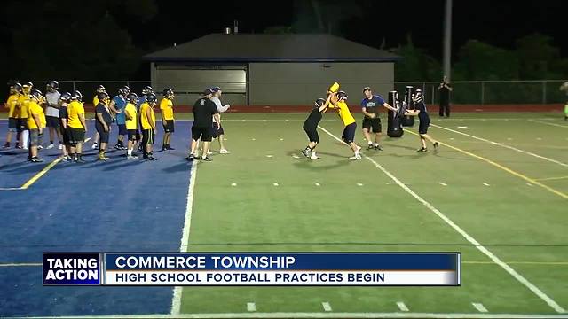 High school football season returns with midnight practice in Commerce Township