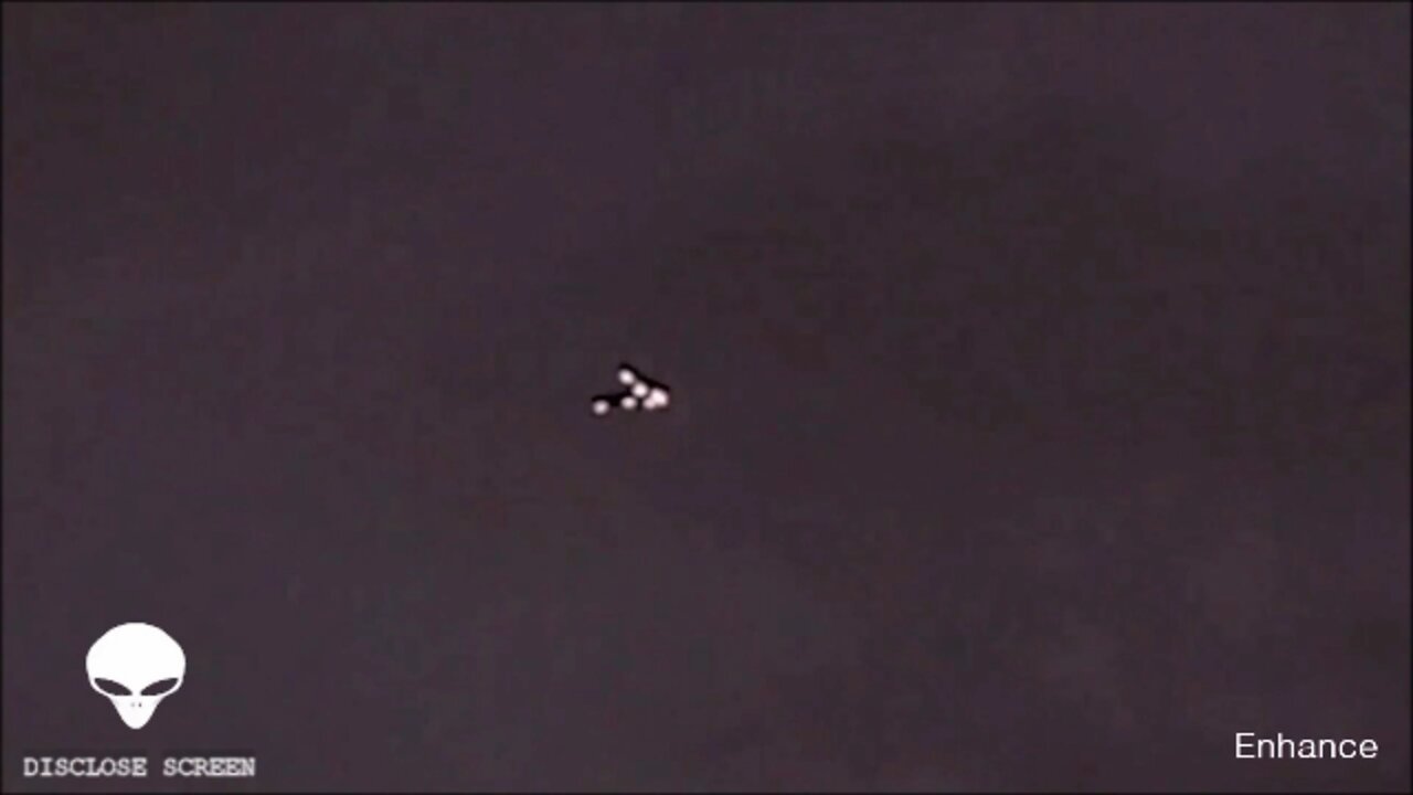 Close up shot of a silent V shaped UFO. Guy left speechless.