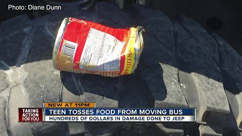 Student throws a can of Chef Boyardee out of a moving school bus window, hitting vehicle