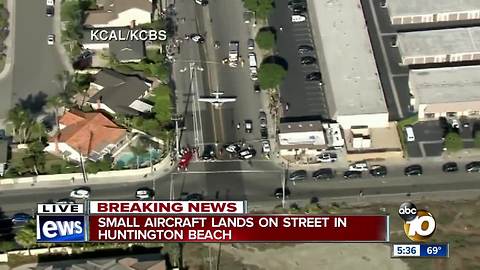 Small aircraft lands on street in Huntington Beach