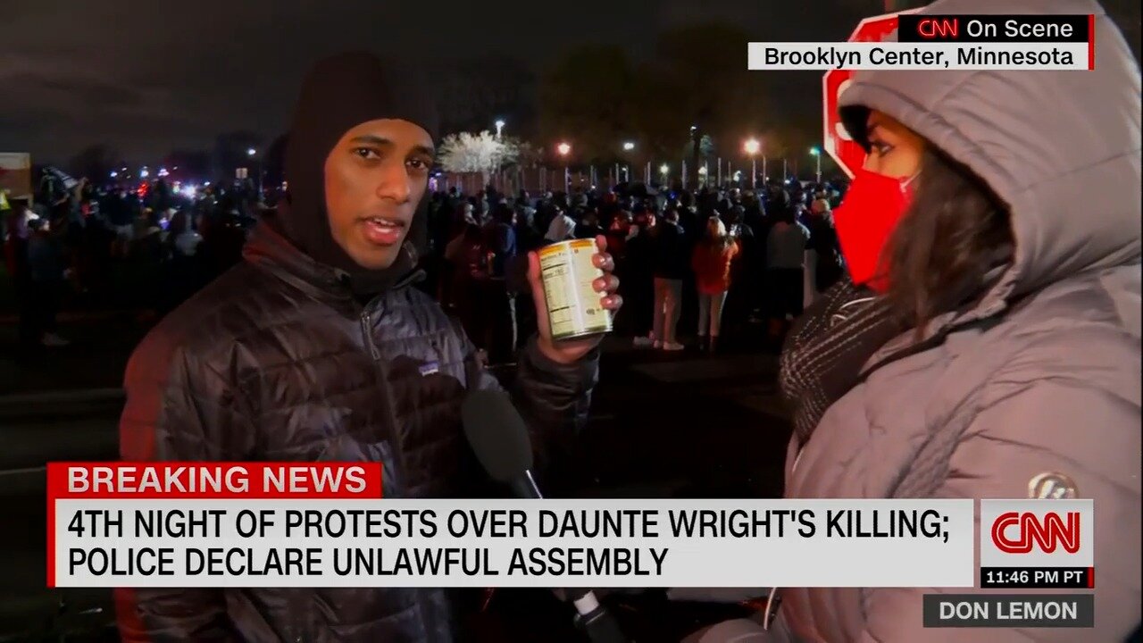 Protestor Winks At Camera As He Shows Off Can of Soup, Used as Weapon to Throw at Police